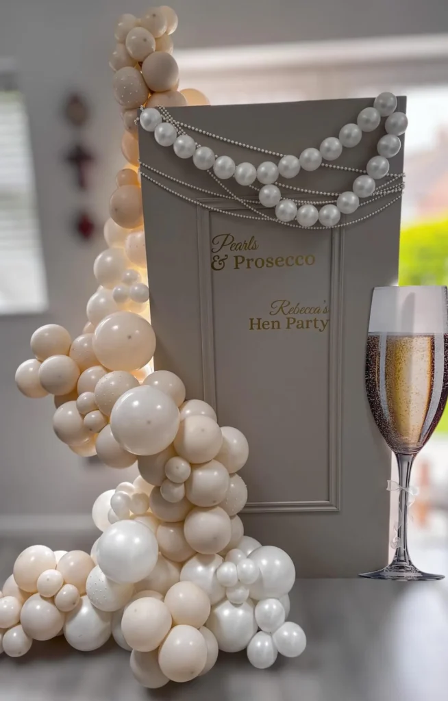 Party Sign with Balloon Cascade