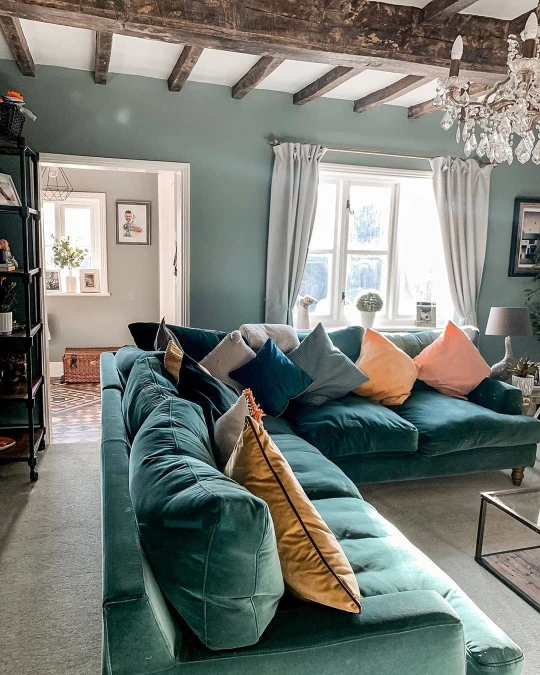 Deep Jade Velvet Sofa And Rustic Beams