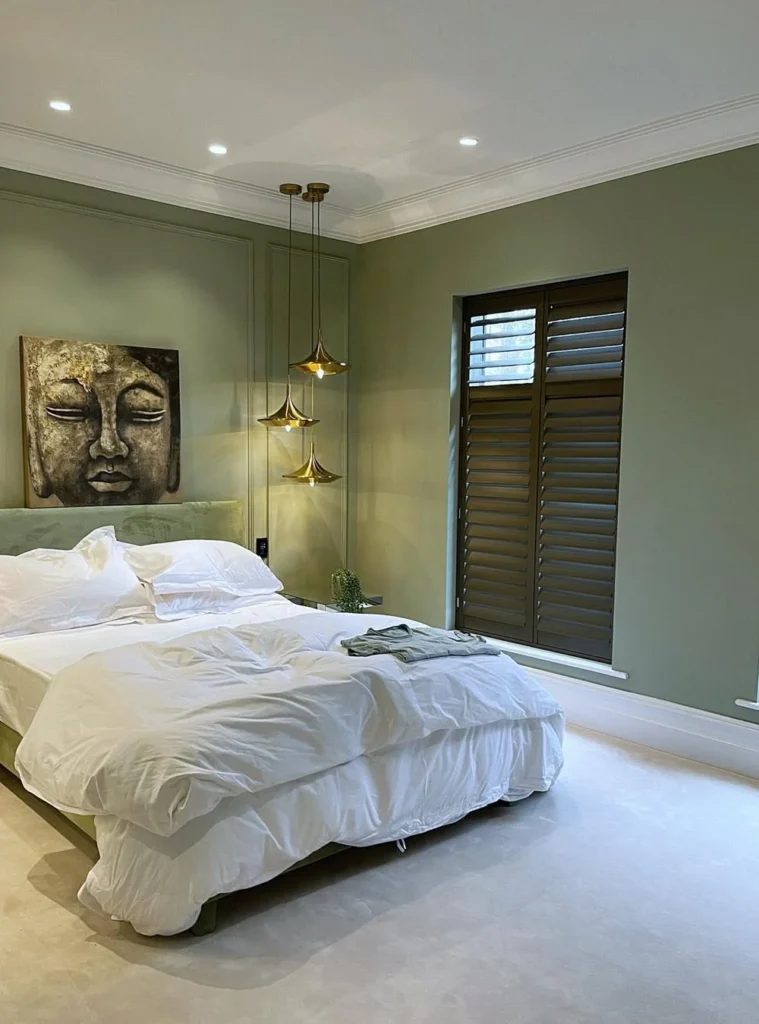 Green Wall Molding and Brass Pendant Lighting