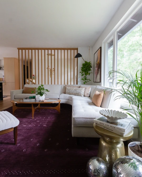 Grounding Airy Mid Century Rooms With A Plum Rug