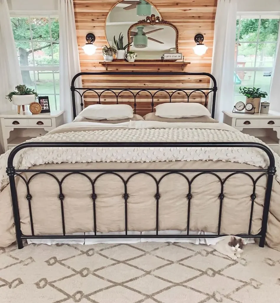 Black Metal Bed and Wood Wall