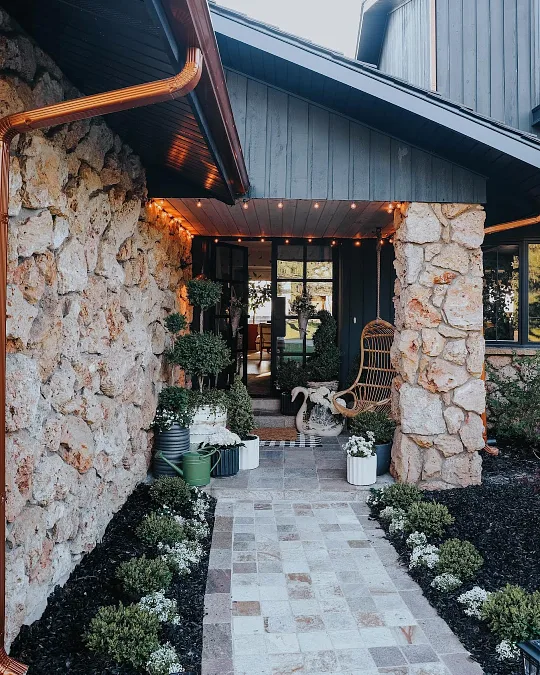 Stone Porch with Greenery and String Lights