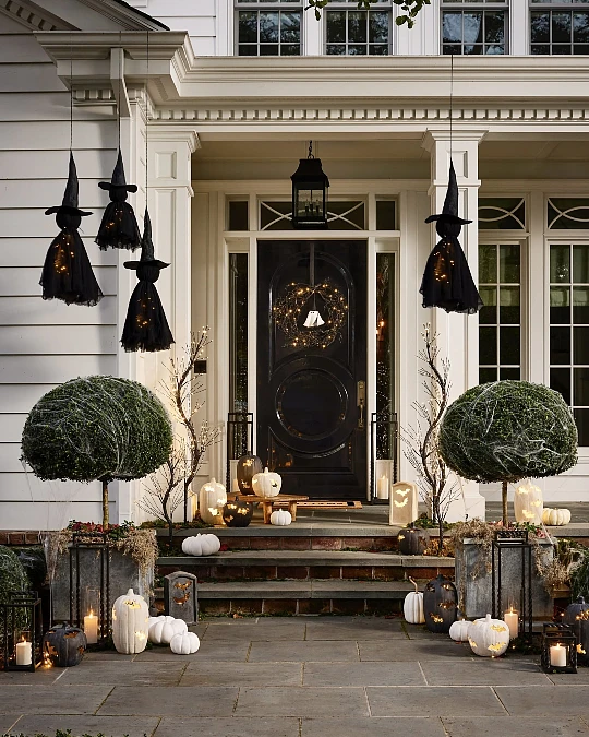 Glowing Witch Figures on the Porch