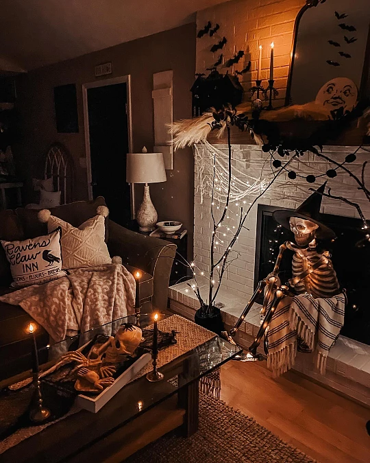 Candlelit Skeleton Mantel with Spooky Branches