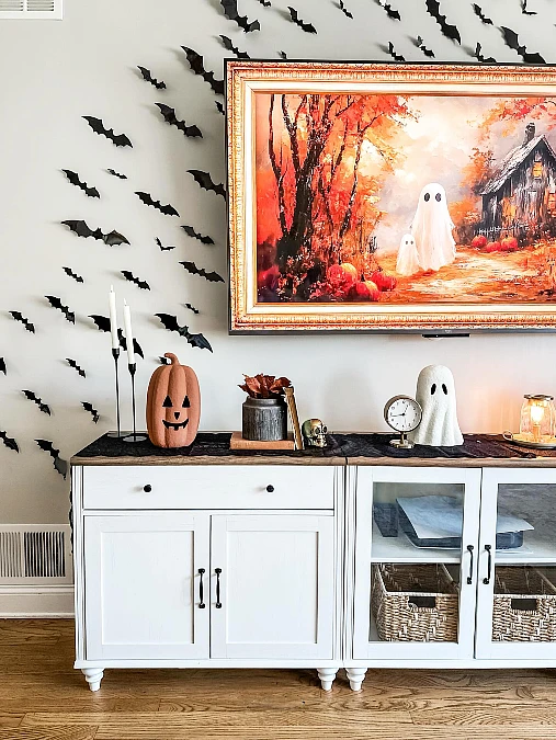 White Sideboard with Bat Wall Decor
